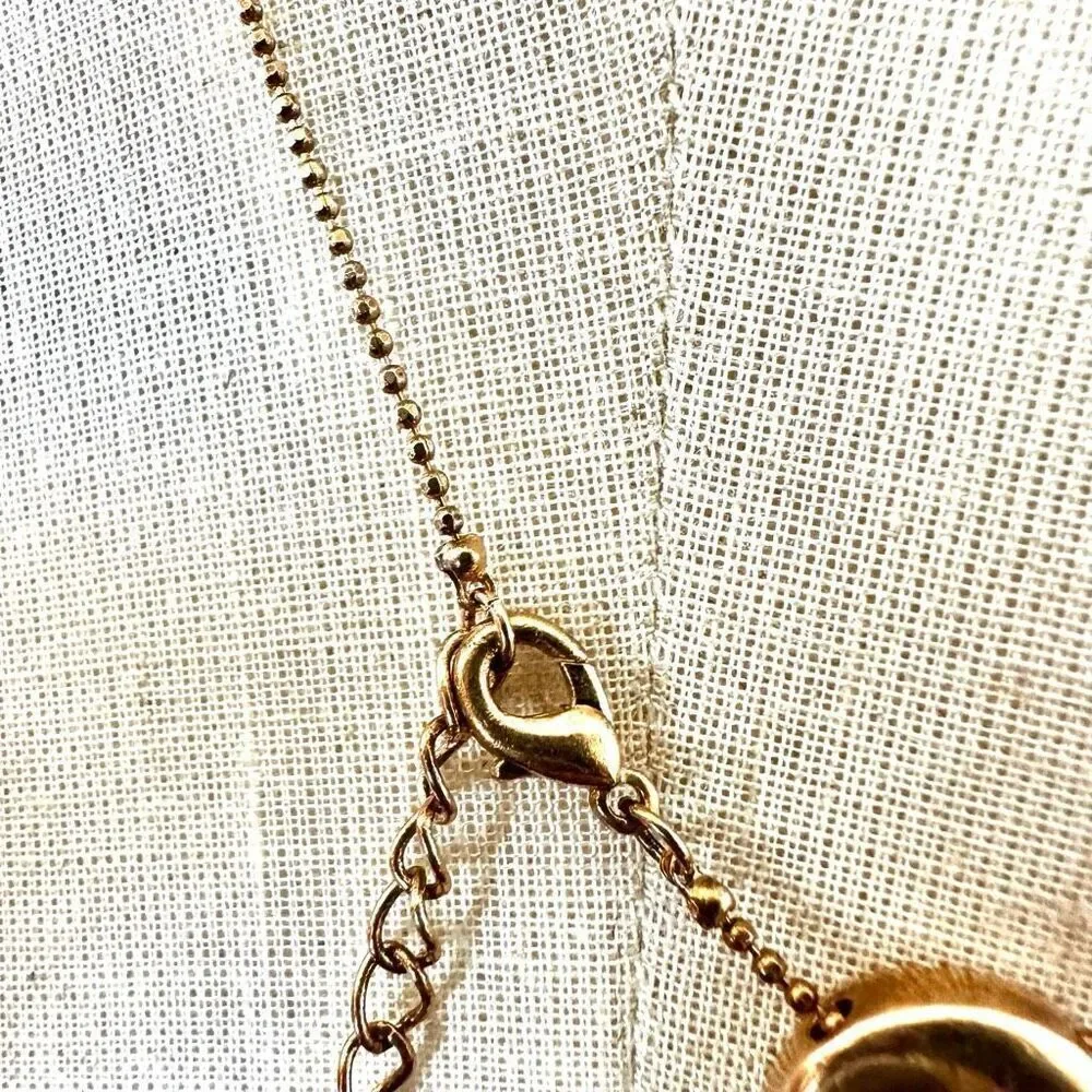 Gold tone open heart pendant necklace